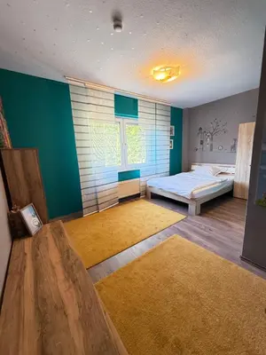 Ein Bett oder Betten in einem Zimmer der Unterkunft Ferienwohnung Hügelstraße