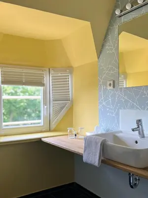 Ein Badezimmer in der Unterkunft Stuckhotel Fettehenne