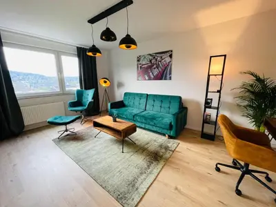 Ein Sitzbereich in der Unterkunft modern * zentral * Netflix * Arbeitsplatz