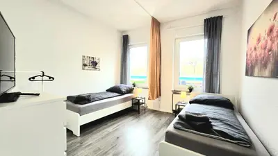 Ein Bett oder Betten in einem Zimmer der Unterkunft Modernes Apartment mit Einzelbetten & WLAN & kostenlosen Parkplätzen & voll ausgestattet in Altena