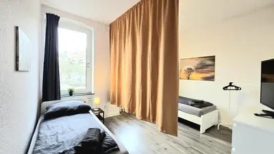 Ein Bett oder Betten in einem Zimmer der Unterkunft Modernes Apartment mit Einzelbetten & WLAN & kostenlosen Parkplätzen & voll ausgestattet in Altena