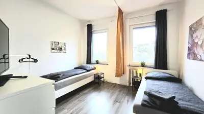 Ein Bett oder Betten in einem Zimmer der Unterkunft Modernes Apartment mit Einzelbetten & WLAN & kostenlosen Parkplätzen & voll ausgestattet in Altena