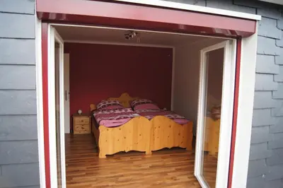Ein Bett oder Betten in einem Zimmer der Unterkunft Ferienwohnung Bergisch Land