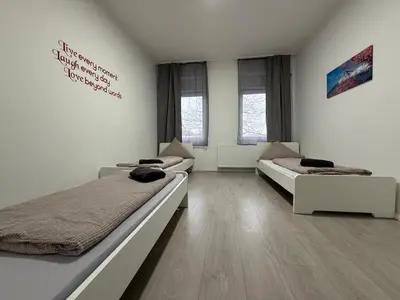 Ein Bett oder Betten in einem Zimmer der Unterkunft estrella24 LIVING ROOMS Tokio