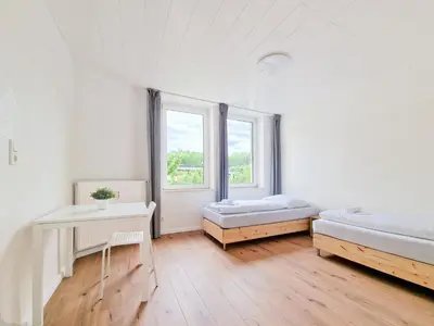 Ein Bett oder Betten in einem Zimmer der Unterkunft Tolstov Apartments - 3 and 4 Room Apartments
