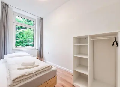 Ein Bett oder Betten in einem Zimmer der Unterkunft Tolstov Apartments - 3 and 4 Room Apartments