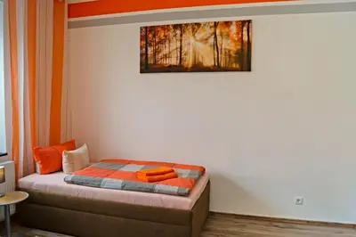 Ein Bett oder Betten in einem Zimmer der Unterkunft Charmante & Gemütliche Wohnung