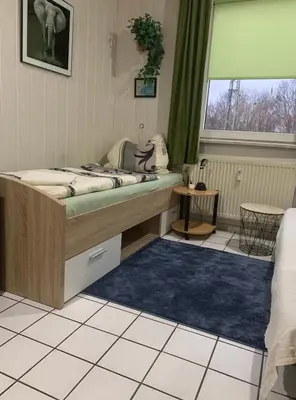 Ein Bett oder Betten in einem Zimmer der Unterkunft PrivatZimmer in einem Haus Inkl Parkplatz nach Verfügbarkeit