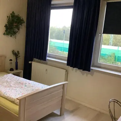 Ein Bett oder Betten in einem Zimmer der Unterkunft Schönes Zimmer 1 Etage inkl Parkplatz nach Verfügbarkeit
