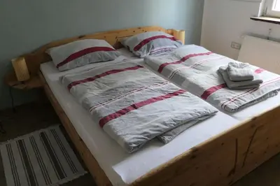Ein Bett oder Betten in einem Zimmer der Unterkunft Ferienwohnung Hückeswagen (Bevertalsperre)