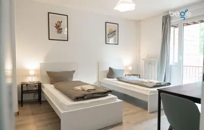 Ein Bett oder Betten in einem Zimmer der Unterkunft BEGE APARTMENTS: PERFECT FOR COMPANIES