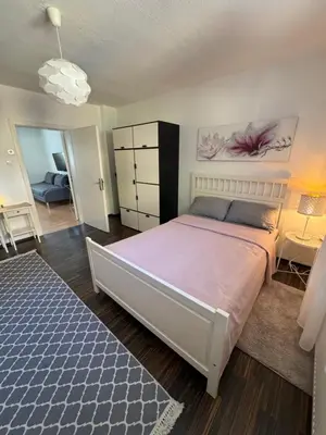 Ein Bett oder Betten in einem Zimmer der Unterkunft Sana Ferienwohnung