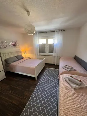 Ein Bett oder Betten in einem Zimmer der Unterkunft Sana Ferienwohnung