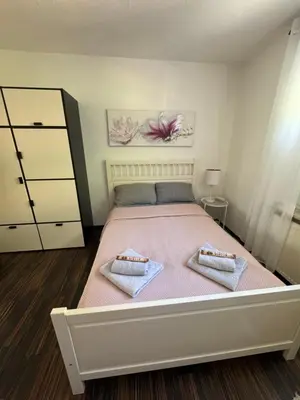 Ein Bett oder Betten in einem Zimmer der Unterkunft Sana Ferienwohnung