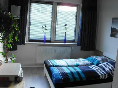Ein Bett oder Betten in einem Zimmer der Unterkunft Cozy Zimmer inkl Parkplatz nach Verfügbarkeit