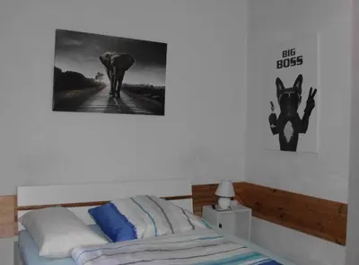 Ein Bett oder Betten in einem Zimmer der Unterkunft Cozy Zimmer inkl Parkplatz nach Verfügbarkeit