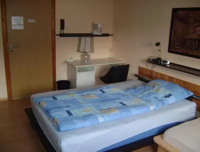 Ein Bett oder Betten in einem Zimmer der Unterkunft Gemütliches Zimmer 2 Et Inkl Parkplatz nach Verfügbarkeit