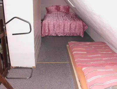 Ein Bett oder Betten in einem Zimmer der Unterkunft Gemütliche Wohnung 2 Et Inkl Parkplatz nach Verfügbarkeit