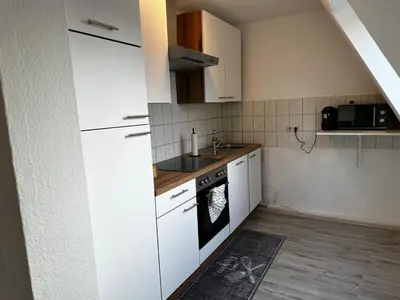Küche/Küchenzeile in der Unterkunft A&V Apartments Schöne Dachgeschoss Wohnung Apt Sterne