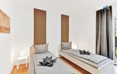 Ein Bett oder Betten in einem Zimmer der Unterkunft BEGE APARTMENTS: STAY & WORK