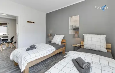 Ein Bett oder Betten in einem Zimmer der Unterkunft BEGE APARTMENTS: STAY & WORK