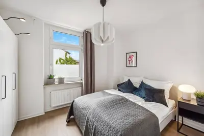 Ein Bett oder Betten in einem Zimmer der Unterkunft Altbau Traum Lothringer im Herzen von Wuppertal - Nähe DUS & Dortmund & Köln & Essen