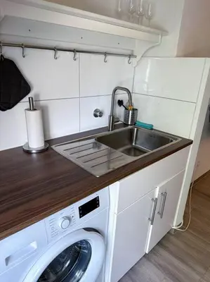 Küche/Küchenzeile in der Unterkunft City Apprtment with Netflix, 2Tv