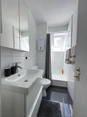 Ein Badezimmer in der Unterkunft City Apprtment with Netflix, 2Tv