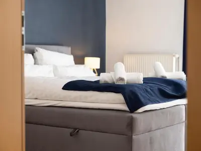 Ein Bett oder Betten in einem Zimmer der Unterkunft Arena in der Nähe - Tiefgarage - Balkon - Küche - Smart TV