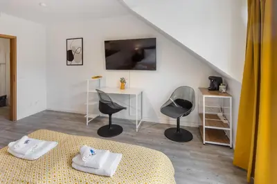 TV/Unterhaltungsangebot in der Unterkunft MINT: Design Studio – Parken – Küche – WiFi