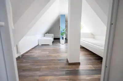 Ein Bett oder Betten in einem Zimmer der Unterkunft XXL Superior Apartment 1 - 1 bis 10 Personen