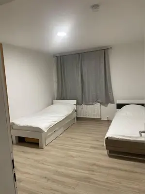 Ein Bett oder Betten in einem Zimmer der Unterkunft Schöne Appartement mit kostenlosen Parkplätze AVD1