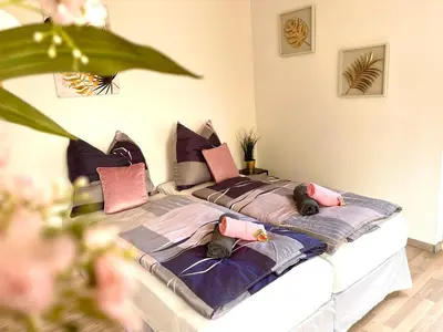 Ein Bett oder Betten in einem Zimmer der Unterkunft Zuhause im Ruhrgebiet 2 mit Balkon