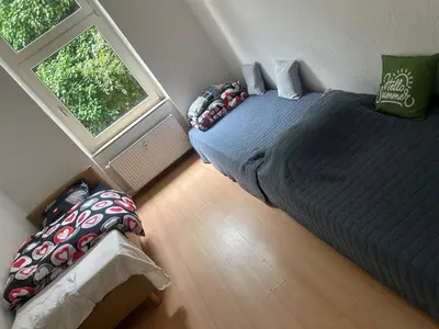 Ein Bett oder Betten in einem Zimmer der Unterkunft 3 Zimmer Mietwohnung nähe HBF