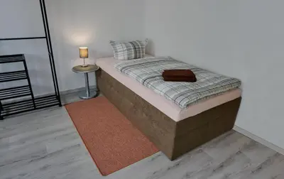 Ein Bett oder Betten in einem Zimmer der Unterkunft Wohnung für 1 bis 3 Personen