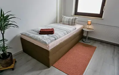 Ein Bett oder Betten in einem Zimmer der Unterkunft Wohnung für 1 bis 3 Personen