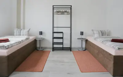Ein Bett oder Betten in einem Zimmer der Unterkunft Wohnung für 1 bis 3 Personen