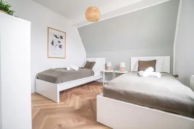 Ein Bett oder Betten in einem Zimmer der Unterkunft NICE & CALM - Wohlfühl-Wohnung in Stadtnähe für Familien oder Freunde