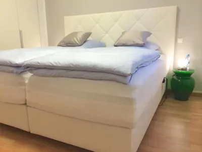 Ein Bett oder Betten in einem Zimmer der Unterkunft RÜ Business Apartments & Suites