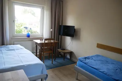 Ein Bett oder Betten in einem Zimmer der Unterkunft Ferienwohnung Illerhues