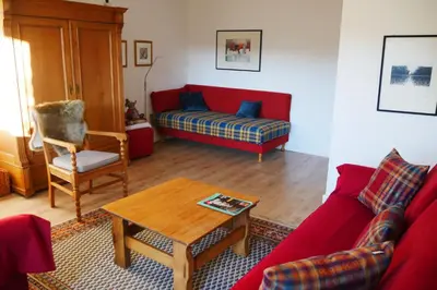 Ein Sitzbereich in der Unterkunft Ferienwohnung Illerhues