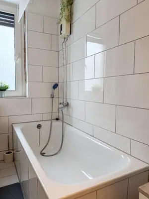 Ein Badezimmer in der Unterkunft Gockel Homes - Zentral mit Balkon & Netflix