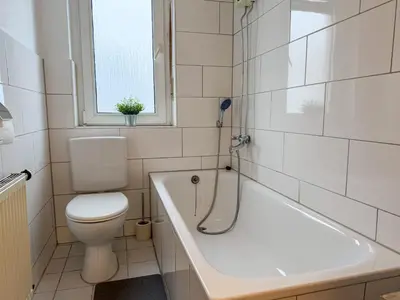 Ein Badezimmer in der Unterkunft Gockel Homes - Zentral mit Balkon & Netflix