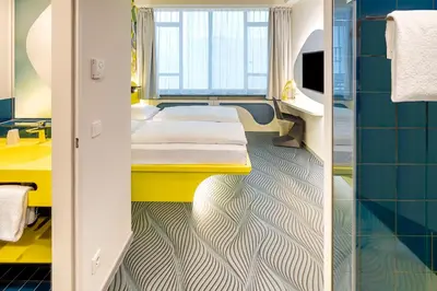 Ein Bett oder Betten in einem Zimmer der Unterkunft Prize by Radisson, Dortmund City