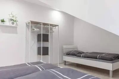 Ein Bett oder Betten in einem Zimmer der Unterkunft Top ausgestattet Netflix Wifi Veltins Arena