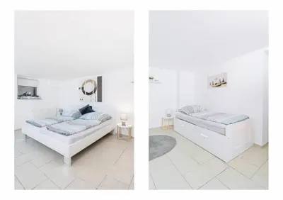Ein Bett oder Betten in einem Zimmer der Unterkunft Top Ausstattung Netflix WLAN CentrO OLGA-Park