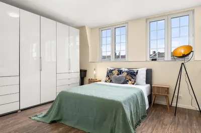 Ein Bett oder Betten in einem Zimmer der Unterkunft Maracoon - Suite Studios Krefeld Uerdingen I 20 Min zur Messe