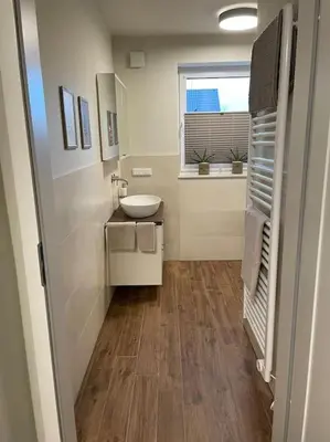 Ein Badezimmer in der Unterkunft Excl. Maisonette Ferienwohnung