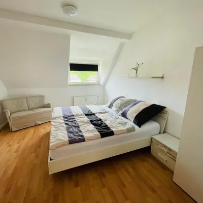 Ein Bett oder Betten in einem Zimmer der Unterkunft Nette Kuschelige Wohnung 2