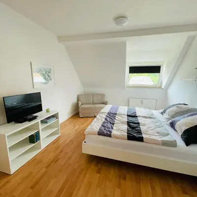 Ein Bett oder Betten in einem Zimmer der Unterkunft Nette Kuschelige Wohnung 2